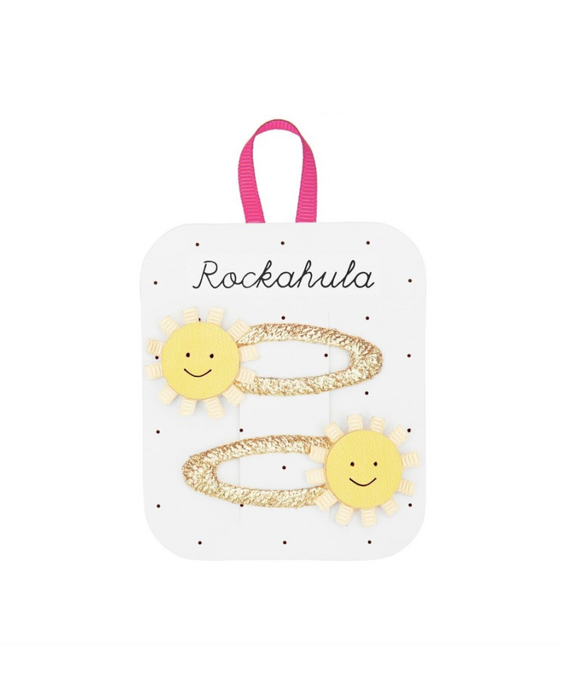 סיכות לשיער לילדות עם שמש מנצנצת על סרט זהב